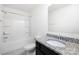 Bathroom with granite counters, shower-tub, tiled floors, and white walls at 5160 Thomasville Dr # 123, Belmont, NC 28012