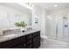 Elegant bathroom with double vanity, granite countertop, and a glass-enclosed shower at 5160 Thomasville Dr # 123, Belmont, NC 28012