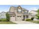 Attractive home featuring a two-car garage, classic architecture, and manicured landscaping at 5160 Thomasville Dr # 123, Belmont, NC 28012