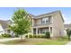 Inviting two-story home featuring manicured landscaping and a charming covered front porch at 5160 Thomasville Dr # 123, Belmont, NC 28012