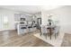 Modern kitchen and dining area featuring stainless steel appliances and granite countertops at 5160 Thomasville Dr # 123, Belmont, NC 28012