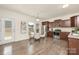 Eat-in kitchen features stainless steel appliances, dark wood cabinetry, and hardwood flooring at 5160 Thomasville Dr # 123, Belmont, NC 28012