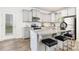 Stylish kitchen showcasing granite countertops, stainless steel appliances, and a breakfast bar at 5160 Thomasville Dr # 123, Belmont, NC 28012