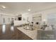 Bright living room with hardwood floors, neutral walls, and an open concept design at 5160 Thomasville Dr # 123, Belmont, NC 28012