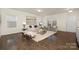 Bright living room with hardwood floors, neutral walls, and a cozy seating area at 5160 Thomasville Dr # 123, Belmont, NC 28012