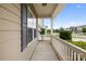 Relaxing outdoor porch area with charming white railings and neighborhood views at 5160 Thomasville Dr # 123, Belmont, NC 28012
