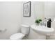 Stylish powder room with a pedestal sink, sleek fixtures, and contemporary decor at 5160 Thomasville Dr # 123, Belmont, NC 28012