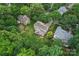 A lovely home surrounded by mature trees featuring a spacious backyard with lush lawn at 5233 Fairvista Dr, Charlotte, NC 28269
