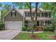 Charming two-story home with a covered front porch, two car garage, and well-manicured lawn at 5233 Fairvista Dr, Charlotte, NC 28269