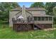 Back exterior showcasing the two-story deck, patio, and screened-in porch at 5233 Fairvista Dr, Charlotte, NC 28269