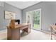Bright home office featuring neutral walls, large window with backyard views and a traditional style desk at 5233 Fairvista Dr, Charlotte, NC 28269
