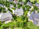 Aerial view of a beautiful home showcasing its spacious landscaped yard within a lush, green neighborhood at 538 Fairwoods Dr, Huntersville, NC 28078