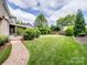 Spacious backyard with lush green grass and an inviting outdoor living space at 538 Fairwoods Dr, Huntersville, NC 28078