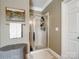 Elegant bathroom featuring a glass-enclosed shower and neutral decor at 538 Fairwoods Dr, Huntersville, NC 28078