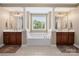 Bright bathroom showcasing double sinks and a relaxing soaking tub at 538 Fairwoods Dr, Huntersville, NC 28078