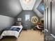 Inviting bedroom featuring a bed, desk, and unique basketball decor at 538 Fairwoods Dr, Huntersville, NC 28078