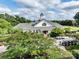 Community clubhouse with manicured landscaping, and ample parking for residents and guests at 538 Fairwoods Dr, Huntersville, NC 28078