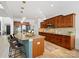 Modern kitchen features granite countertops, stainless steel appliances, pendant lighting and breakfast bar seating at 538 Fairwoods Dr, Huntersville, NC 28078