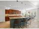 Gourmet eat-in kitchen with stainless steel appliances, designer fixtures, granite countertops, and eat-in bar at 538 Fairwoods Dr, Huntersville, NC 28078