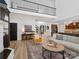 Open-concept living space with a fireplace, staircase and view of the kitchen at 538 Fairwoods Dr, Huntersville, NC 28078