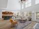 Spacious living room with high ceilings, open layout, modern lighting, and views to the kitchen and dining areas at 538 Fairwoods Dr, Huntersville, NC 28078