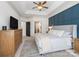 Well-lit main bedroom with a large bed, and a doorway leading to the bathroom at 538 Fairwoods Dr, Huntersville, NC 28078