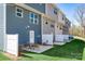 Townhome patio with wicker seating and privacy fence offers a relaxing outdoor space at 5752 Knox Ln, Kannapolis, NC 28081