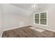 Bedroom with hardwood floors, neutral walls, white trim and double window at 6655 Maple Spring Ct, Denver, NC 28037