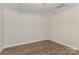 Bedroom with wood-look flooring and a patterned, drop ceiling at 6655 Maple Spring Ct, Denver, NC 28037