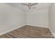 Bedroom features wood-look floors, a drop ceiling and a ceiling fan at 6655 Maple Spring Ct, Denver, NC 28037