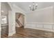 Dining room showcases hardwood floors, crown molding, and views of the home's staircase at 6655 Maple Spring Ct, Denver, NC 28037