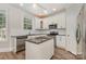 Updated kitchen with granite countertops, stainless steel appliances, and center island at 6655 Maple Spring Ct, Denver, NC 28037