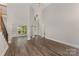 Bright, open living room with soaring ceilings and elegant staircase with wood and iron at 6655 Maple Spring Ct, Denver, NC 28037