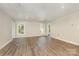 A clean room with luxury vinyl plank flooring, two windows and white painted trim at 6655 Maple Spring Ct, Denver, NC 28037