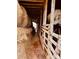 Hay storage area, featuring exposed wooden beams, with bales of hay along the side of the barn at 6714 Old Shelby Rd, Vale, NC 28168