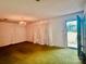Bright living room with chandelier and classic touches, featuring an open doorway to the outside at 6714 Old Shelby Rd, Vale, NC 28168