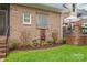 Beautiful backyard featuring a fountain, flower pots, and manicured lawn, perfect for relaxation and enjoying nature at 7018 Dowington Dr, Charlotte, NC 28277