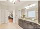 This bathroom features a granite countertop, neutral tile flooring, and an open doorway to the bedroom at 7018 Dowington Dr, Charlotte, NC 28277