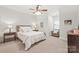 Bedroom featuring neutral color palette, ceiling fan, carpeted floor, and ambient lighting at 7018 Dowington Dr, Charlotte, NC 28277