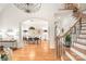 Stylish dining area with hardwood floors, modern lighting, and elegant décor, ideal for Gathering gatherings at 7018 Dowington Dr, Charlotte, NC 28277