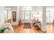 Bright foyer with hardwood floors, grand entrance, stylish decor, and elegant front door at 7018 Dowington Dr, Charlotte, NC 28277