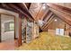 Exposed attic framing with insulation and carpeting. Good opportunity for renovation at 725 W Graham St, Shelby, NC 28150