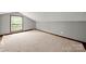 Bright attic with good lighting, featuring hardwood floors and a window; great for storage or expansion at 725 W Graham St, Shelby, NC 28150