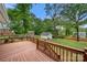 Backyard deck with mature trees, well manicured backyard and storage sheds at 725 W Graham St, Shelby, NC 28150