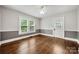 Cozy bedroom features hardwood floors, neutral paint, and bright windows at 725 W Graham St, Shelby, NC 28150