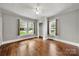 Comfortable bedroom with hardwood floors, ample light, and closet at 725 W Graham St, Shelby, NC 28150