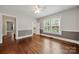 Light-filled bedroom with hardwood floors, neutral walls, and ample closet space at 725 W Graham St, Shelby, NC 28150