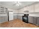 Spacious kitchen featuring bright cabinets, tile backsplash, modern appliances, and ample countertop space at 725 W Graham St, Shelby, NC 28150