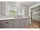 Charming kitchen with ample natural light, featuring modern countertops and gray cabinets at 725 W Graham St, Shelby, NC 28150
