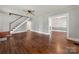Spacious living room showcases hardwood floors, staircase, and neutral paint scheme at 725 W Graham St, Shelby, NC 28150